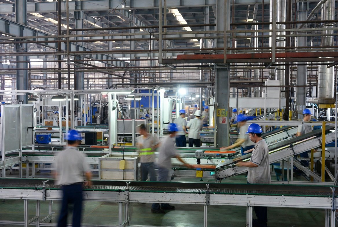 a factory floor plan with workers in a factory China sourcing agent
