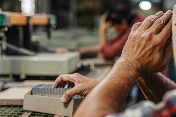 Close-up of worker hands assembling products (ID#3)