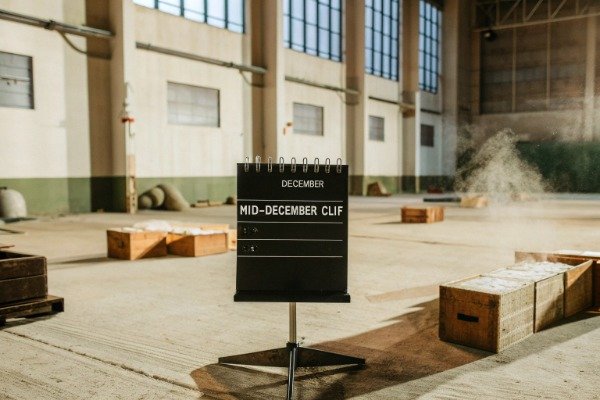 Empty factory floor mid-December with scattered wooden crates (ID#3)