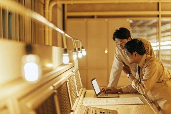 Sourcing agents discussing intellectual property protection and product development for international B2B clients.