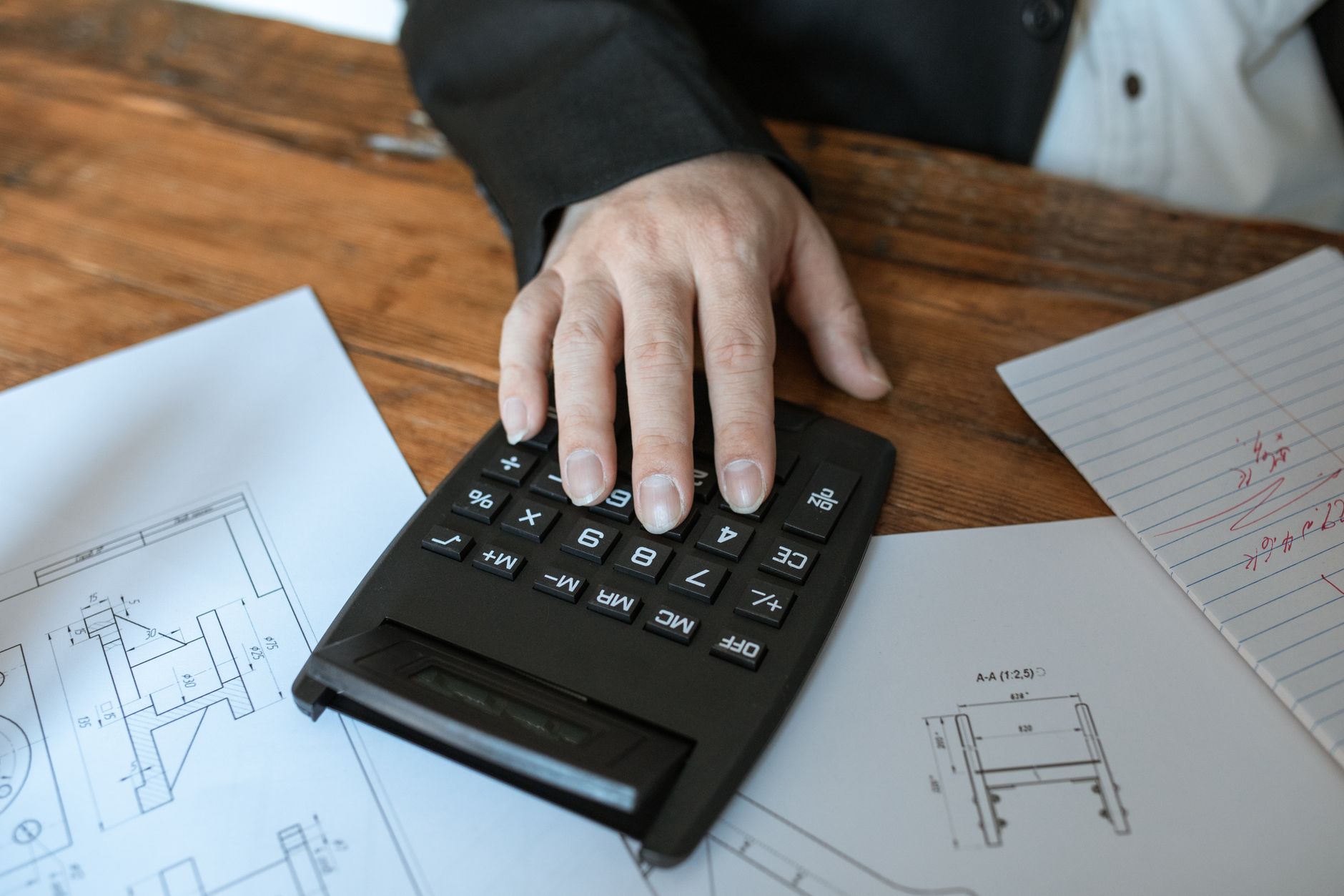 Calculator and layered chart representing Section 301 tariff pricing assumptions