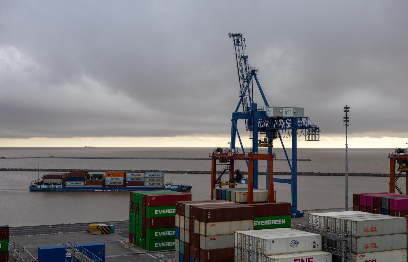 Cargo cranes and containers at a European shipping port